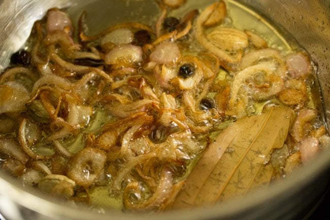 onions turning golden in the ghee