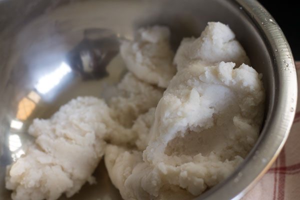 kneading dough for dry fruit modak. 