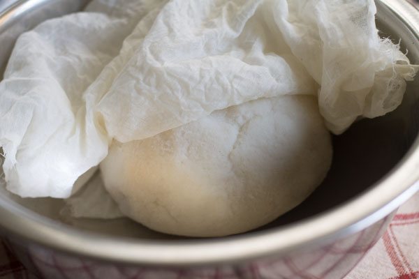 covering dough with a damp linen cloth. 