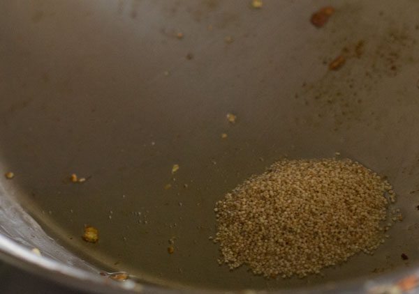 sautéing poppy seeds in hot ghee in pan. 