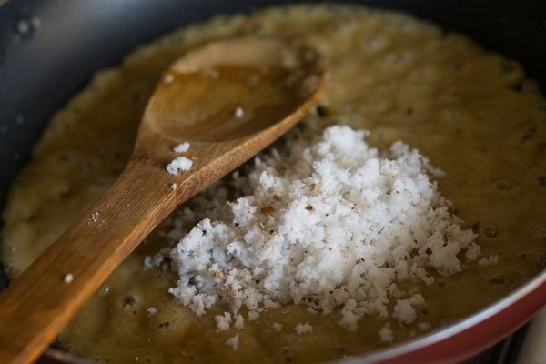 grated fresh coconut added to the khoya-sugar mixture. 