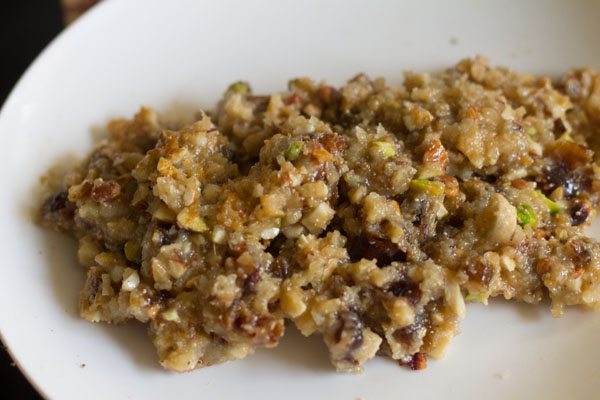 cooked dry fruit filling mixture transferred on a plate. 