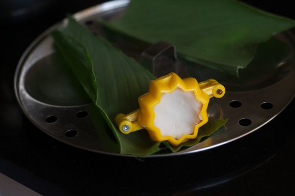 small dough ball added to a modak mould. 