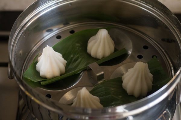 modaks kept in the steamer pan for steaming. 