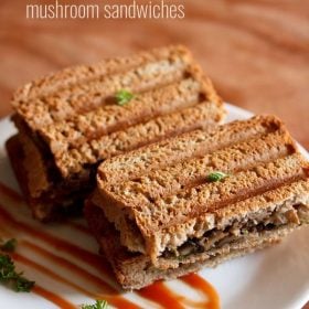 mushroom sandwich on a white plate with ketchup.