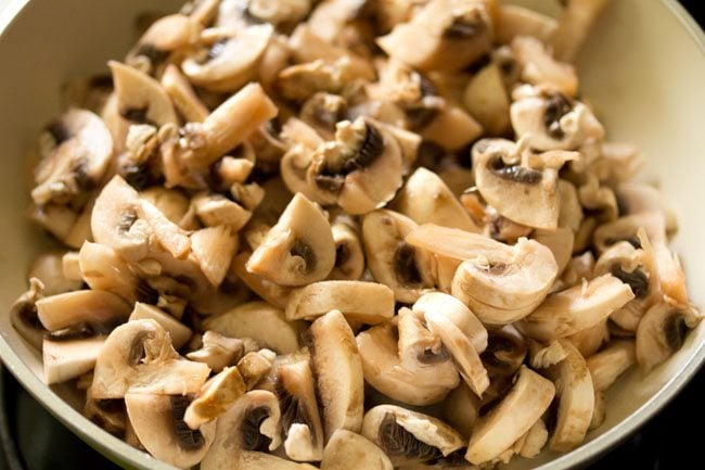 chopped button mushrooms added in the pan. 