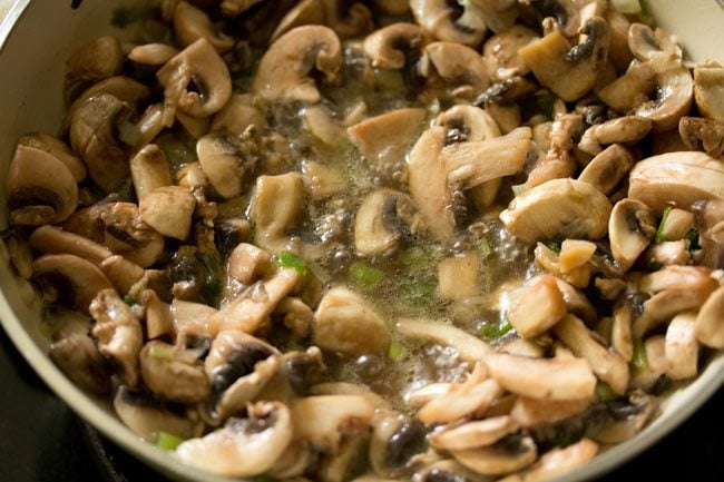 sautéing mushrooms in the pan