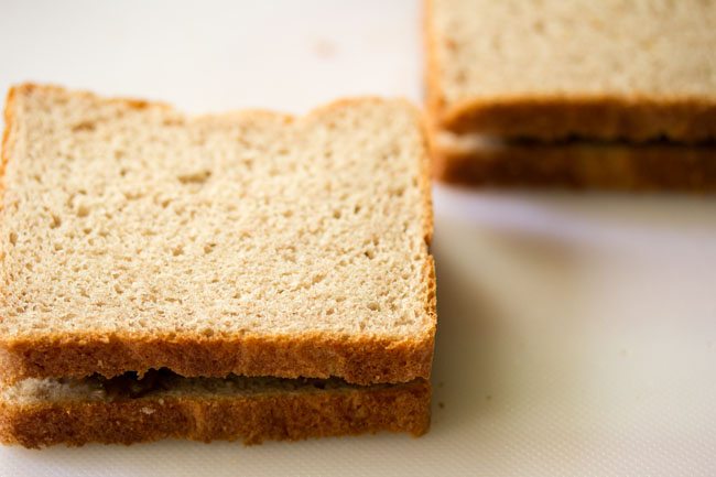 covering with another bread slice to make mushroom sandwich