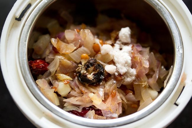 onion mixture for onion chutney in a grinder with tamarind and salt to taste