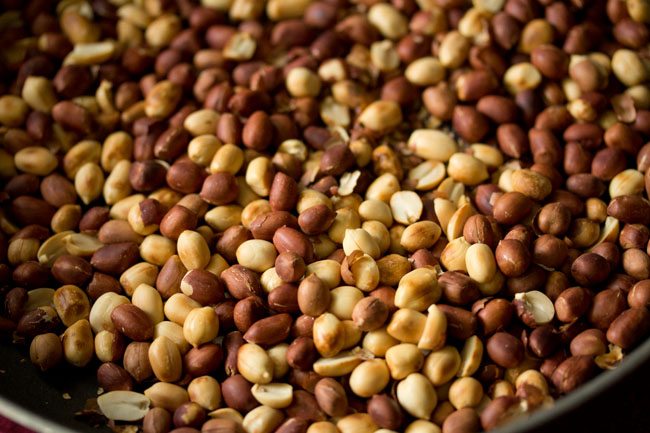 peeling roasted peanuts. 