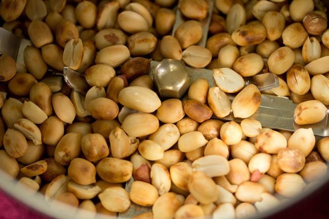 peeled roasted peanuts added to a grinder jar. 