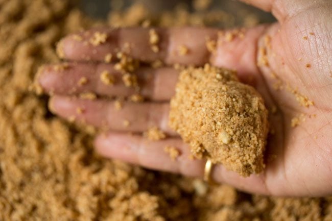 shaping a ladoo from the prepared mixture. 