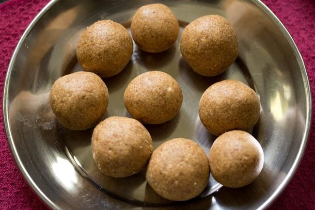 peanut ladoos on a plate. 