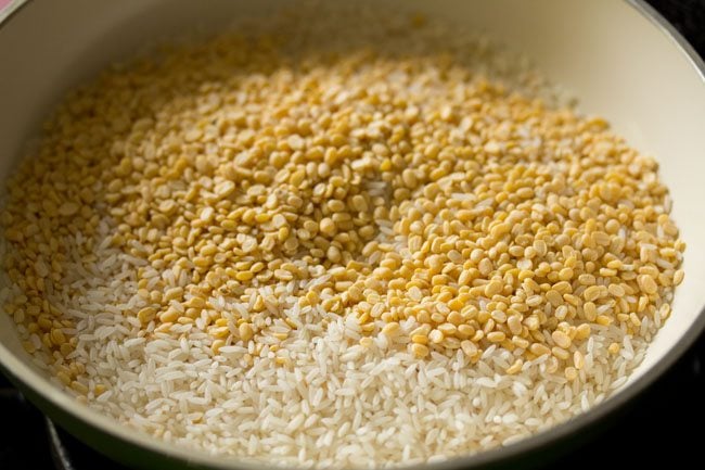 moong dal and rice in a pan for making sweet pongal