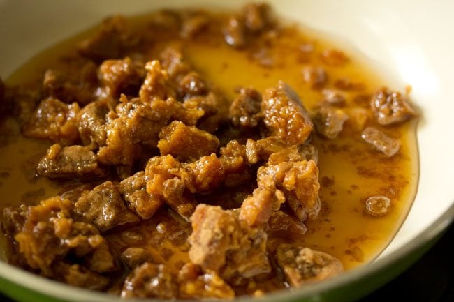 chopped jaggery and water in a frying pan