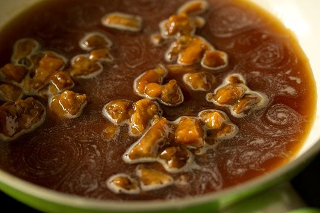 jaggery and water being heated