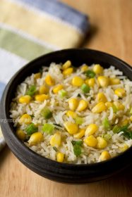 corn fried rice in a black bowl