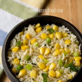 corn fried rice served in a black bowl with text layovers.