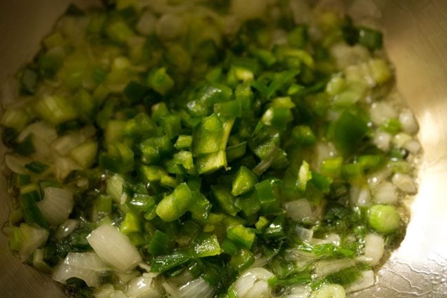 chopped capsicum added to the wok. 