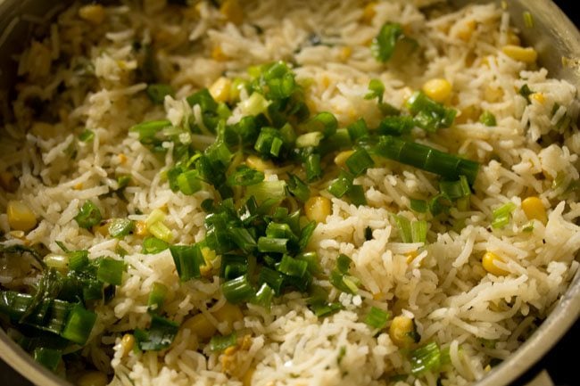 chopped spring onion greens added to the corn fried rice. 