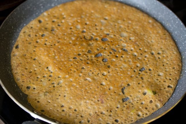 cooked wheat dosa on the pan