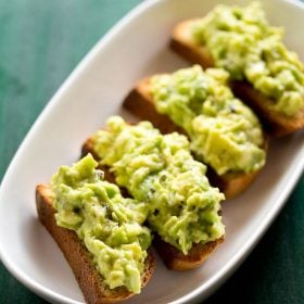 avocado toast served in a white platter.