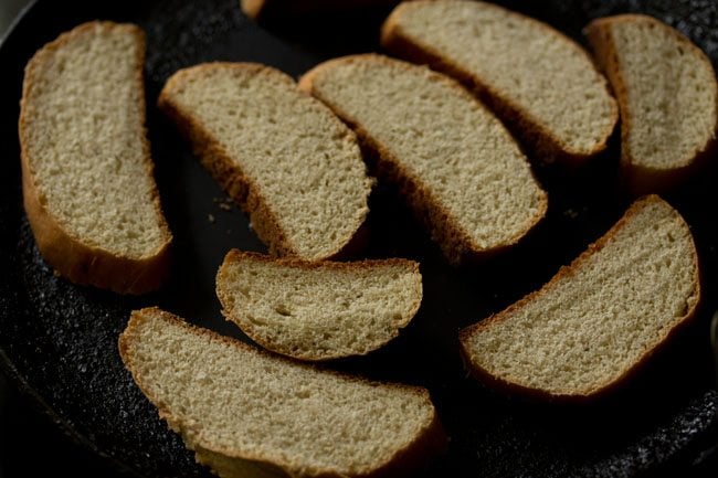 baguette slices on a skillet