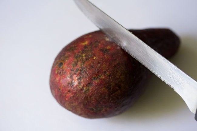 avocado being cut with a knife