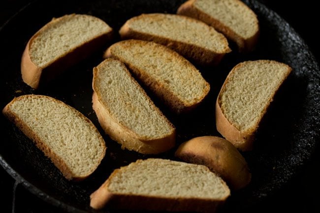 toasting bread slices on skillet