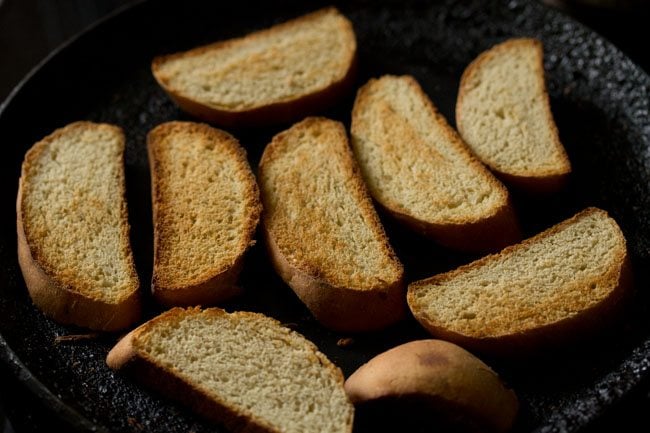 toasting bread slices on skillet