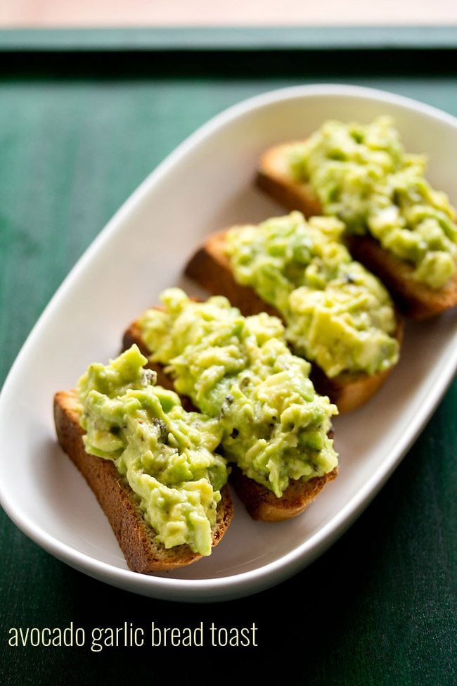 avocado toast served in a white platter.