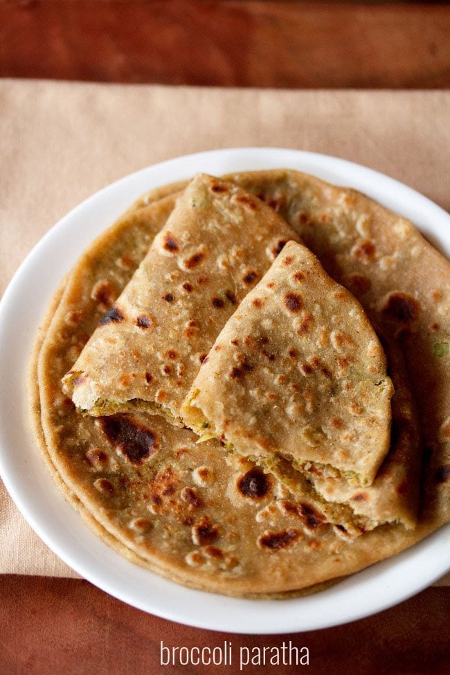 broccoli paratha served on a white plate.