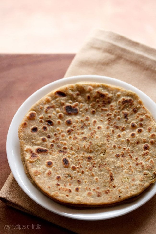 broccoli paratha served on a white plate