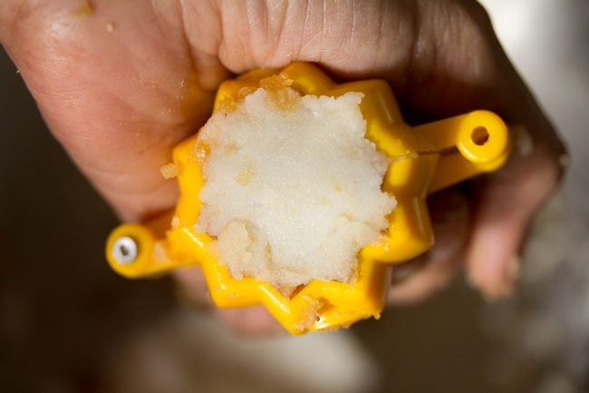 stuffing mixture covered with a small portion of dough on top and pressed. 