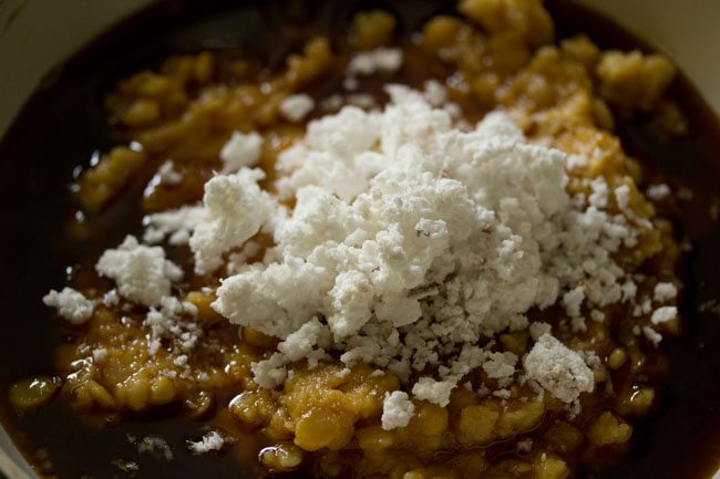 grated fresh coconut added to the chana dal-jaggery mixture. 