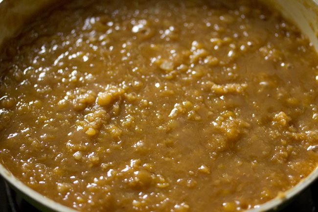 cooking chana dal-jaggery-coconut mixture till it thickens. 