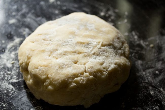 flour sprinkled on rough puff pastry dough ball.