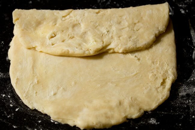 folding the top third of the pastry down to the middle.