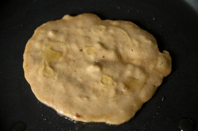 oil drizzled on top of the banana pancake