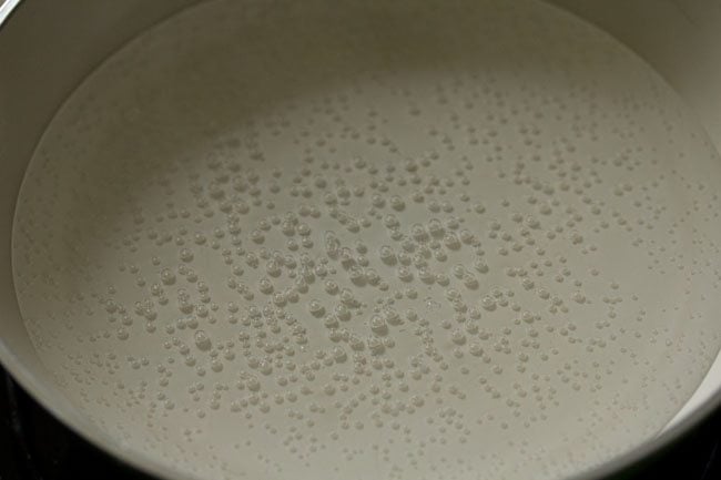 heating milk in a pan for making cocoa solution. 