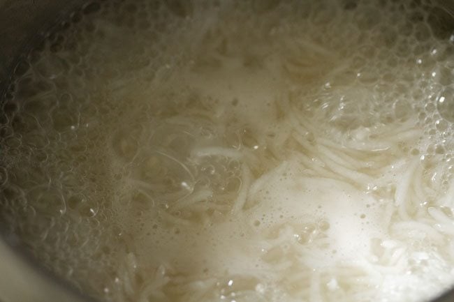 cooking rice on high flame in the pan