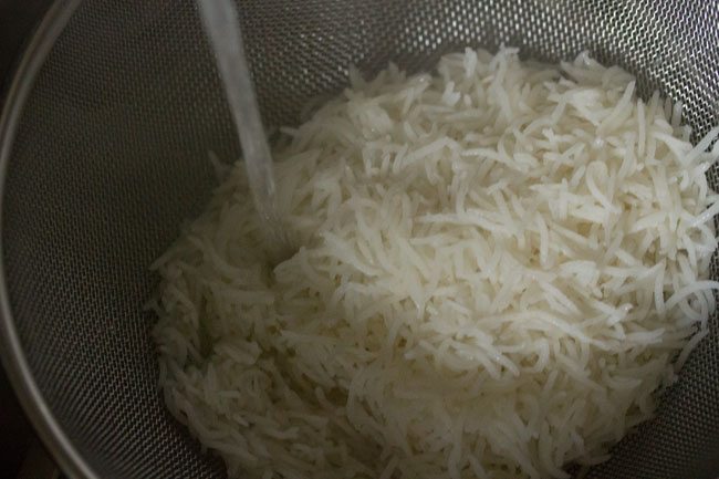 rinsing rice with running water