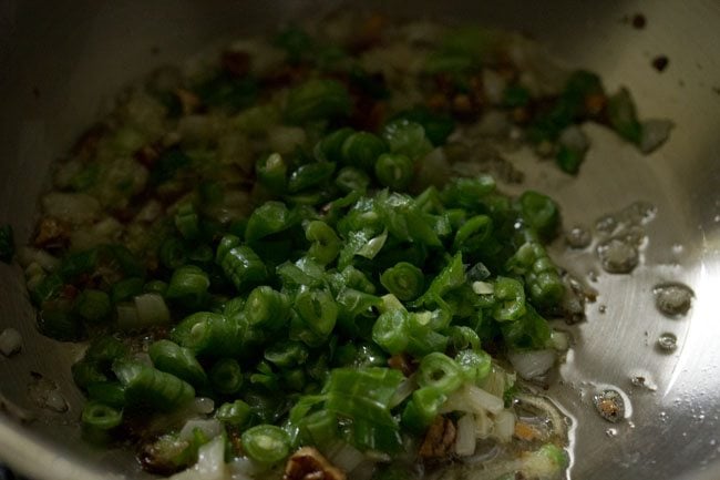 finely chopped french beans added to wok