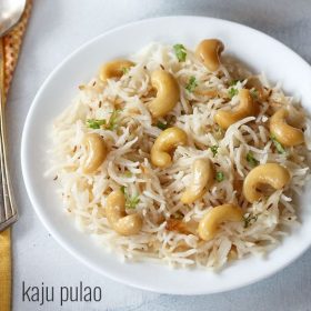 kaju pulao served on a white plate.