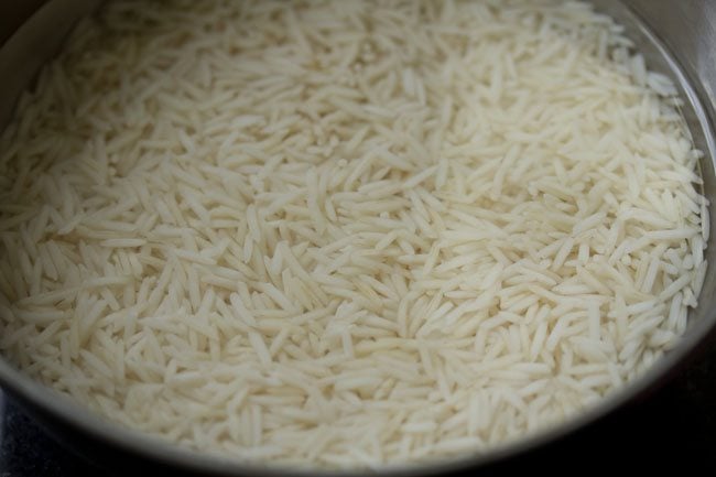 rinsing basmati rice for kaju pulao.