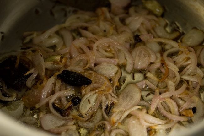 sautéing onions in the hot ghee. 