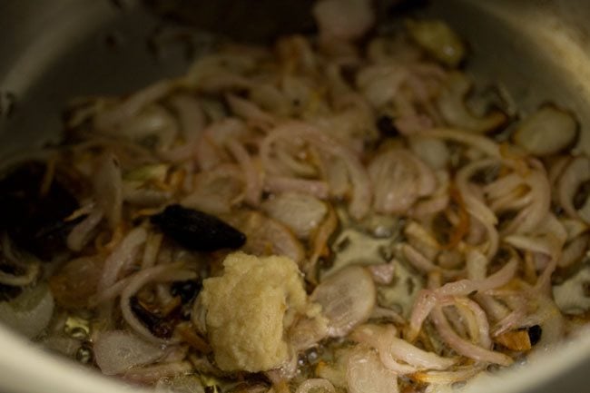 ginger-garlic paste added to the pressure cooker.