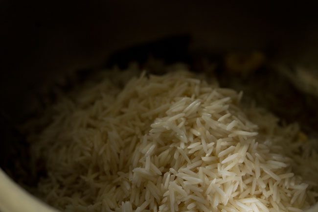 soaked basmati rice added to the pressure cooker. 
