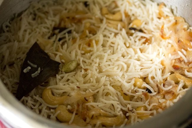 cooked kaju pulao in the pressure cooker.