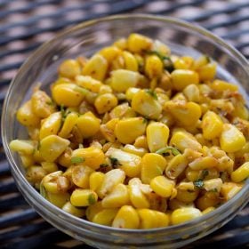 masala corn served in a glass bowl with text layover.